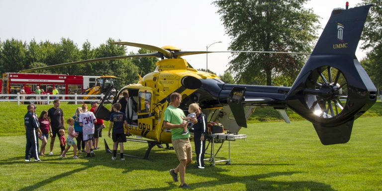 Lining up to Touch-a-Truck at Yellig Park
