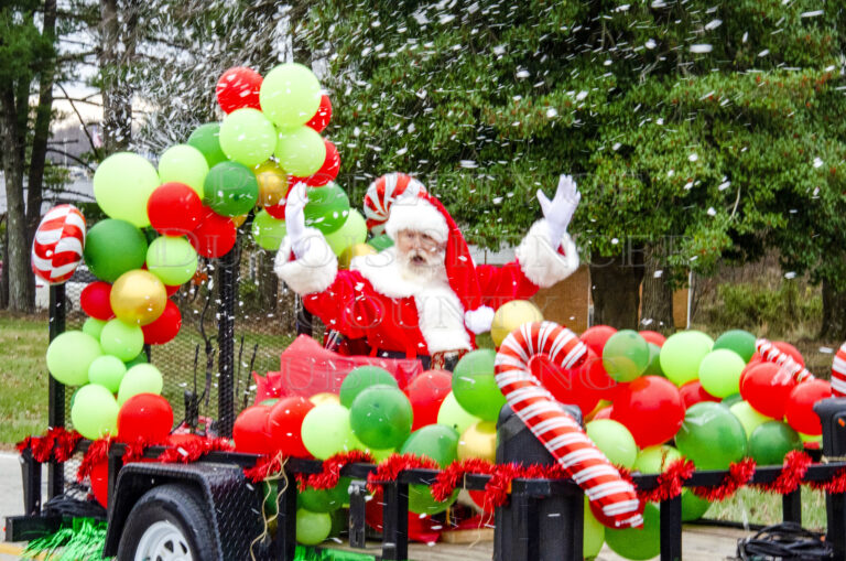 Here comes Santa Claus, right by Santa Claus Town Hall