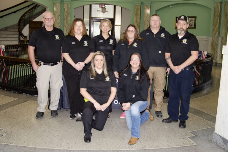 Coroner presents deputies with new badges
